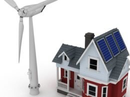 Minieólica vivienda con aerogenerador junto a una casa